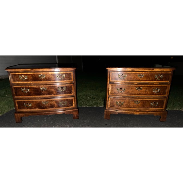 An exceptional, showroom-ready pair of vintage Georgian Revival style bow-front bachelor chests/nightstands from...