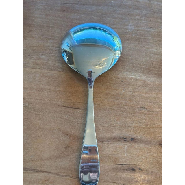 Yamazaki Stainless Steel 9-inch Round Bowl Serving Spoon. This high-quality serving piece features a polished mirror...