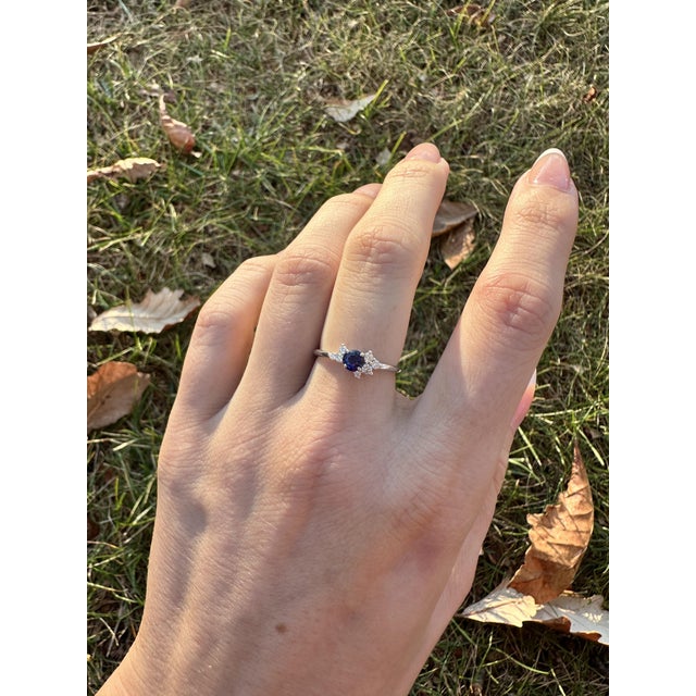 This cool offset diamond accent design ring features a royal blue Ceylon sapphire in solid 14k gold. A unique ring design...