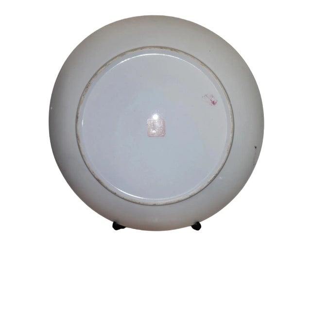 Lovely unique Chinese handpainted decorative plate with peacock feather motif, in exellent condition. Mid century...