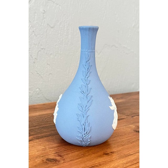 Beautiful pale blue color with mythical imagery popping out in cream. Nice craftsmanship, having detailed and fluted neck...