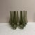 A set of nine smoked glass tapered hurricane style chandelier shades that stand.9.5" H x 1.5"D at top x 3"D opening at...