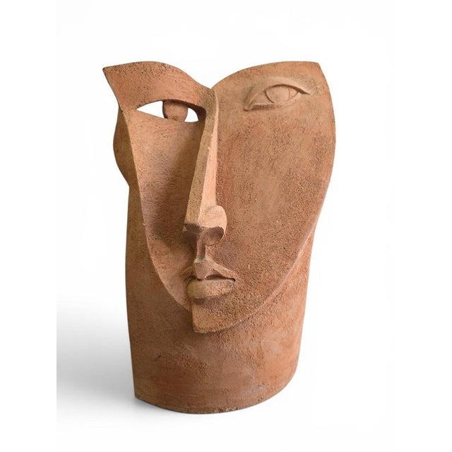 Striking Cubist-style head sculpture executed in terracotta during the 1970s. This unique artistic work reflects the...