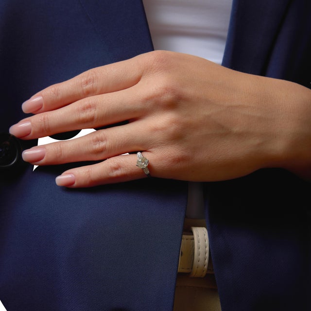 This graceful Edwardian engagement ring showcases a beautifully charming old mine cut diamond, radiating soft, romantic...