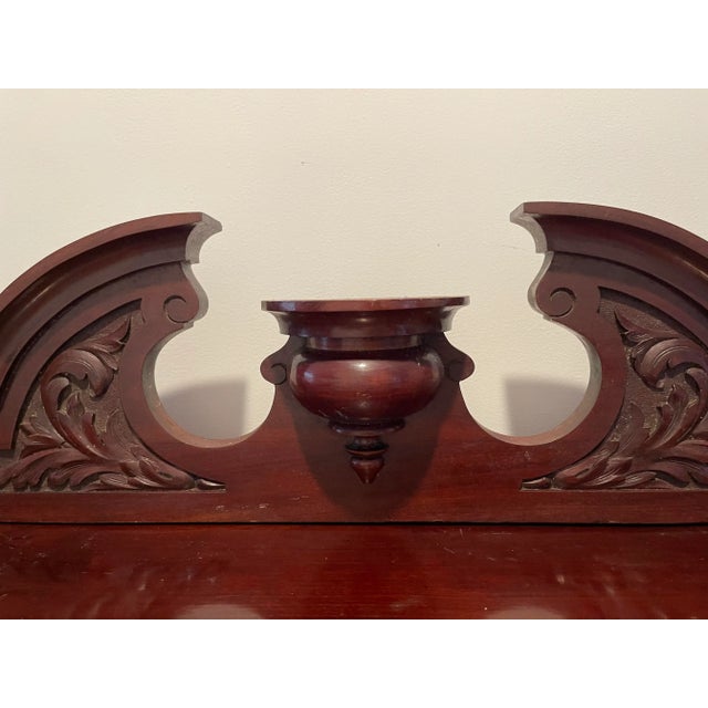 Antique Mahogany Sideboard, with two open shelves and two drawers , crowned by a carved beveled mirrored top .Solid heavy...