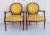 Louis XVI style walnut frames with yellow upholstery and rounded backs.