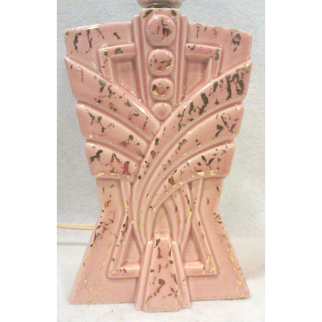 An American made 1950's atomic style ceramic accent lamp in pink ceramic with an architectural stepped form. This Majestic...
