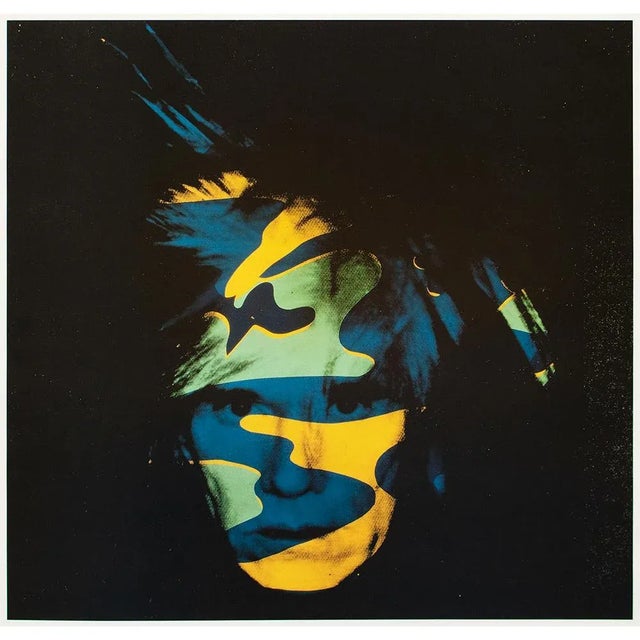 An excellent large offset lithograph of acrylic and silkscreen on canvas "Self-Portrait (Camouflage)" (1986) by Andy...
