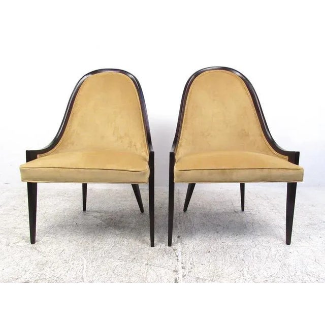 This stunning pair of Mid-Century Gondola chairs by Harvey Probber makes an elegant statement in any setting. Comfortable...