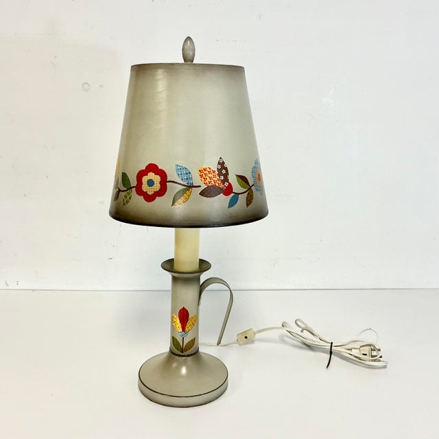 This is a sweet little table lamp that features a print Calico flora design on both the cardboard shade and stem of the...