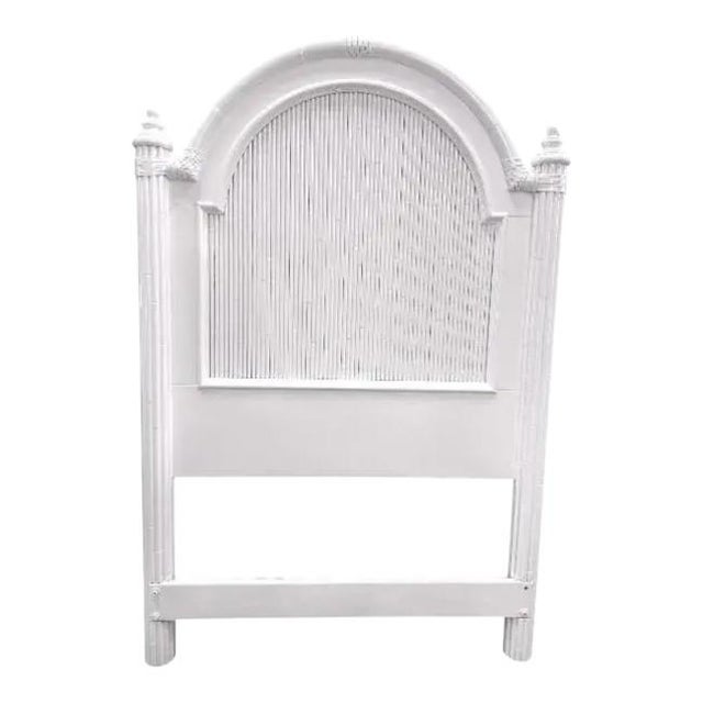 This striking pair of vintage Tommy Bahama twin headboards features a tall arched design with woven paneling and turned...