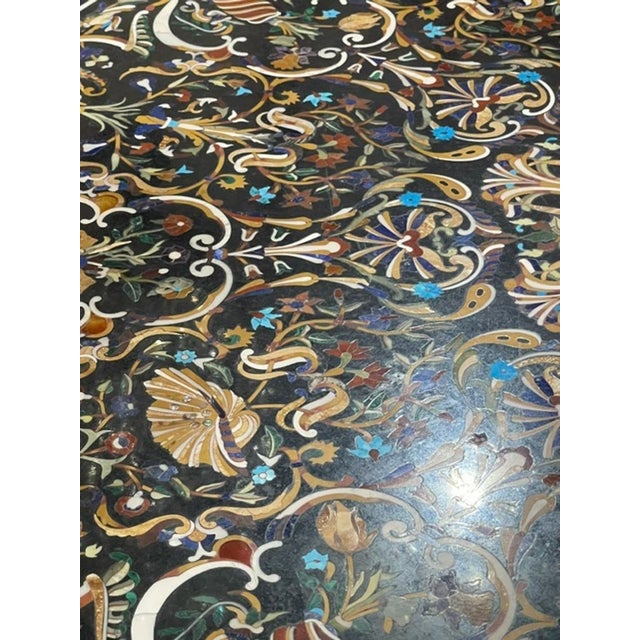 This Italian Pietra Dura inlaid marble center table is a luxurious and elegant furniture. The intricate design and...