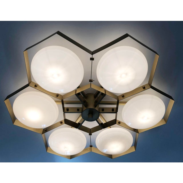 Italian midcentury flush mount with six glossy gray Murano glass shades mounted on solid brass frame in satin brass finish...