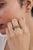This two-in-one stackable band ring set features 2.18 carats of rich green oval-cut emeralds set in a horizontally 14K...