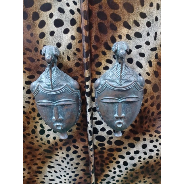 Exceptional Animal Print Maitland Smith Dry Bar. This bar has tribal bronze legs and hardware and 3 removable glass...