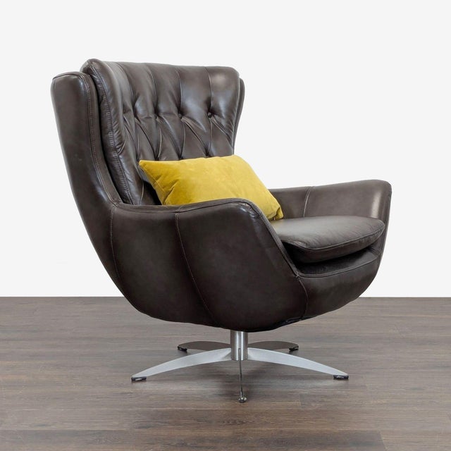 This chair features a modern design with brown leather upholstery and a sleek metal swivel base. The chair includes a...