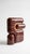 The smallest lamp in the collection, and often the first one people reach for. Its folded form hides the source entirely,...