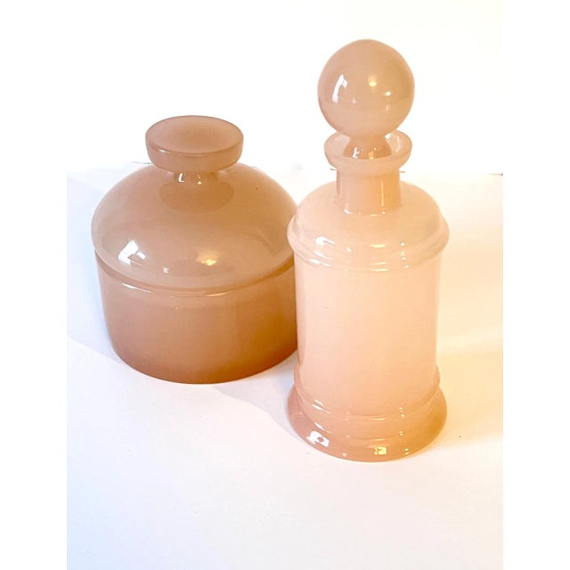 Hand Blown Italian Murano Cenedese apothecary Jar. The piece is a unique shade of pink. A compliment to any vanity, desk...