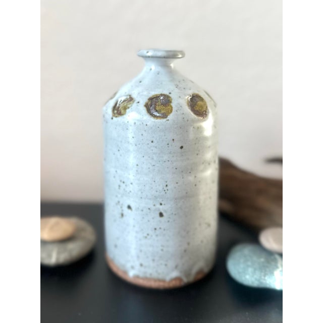 A beautiful example of vintage studio pottery, this handcrafted stoneware bud vase captures the essence of organic modern...