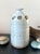 A beautiful example of vintage studio pottery, this handcrafted stoneware bud vase captures the essence of organic modern...