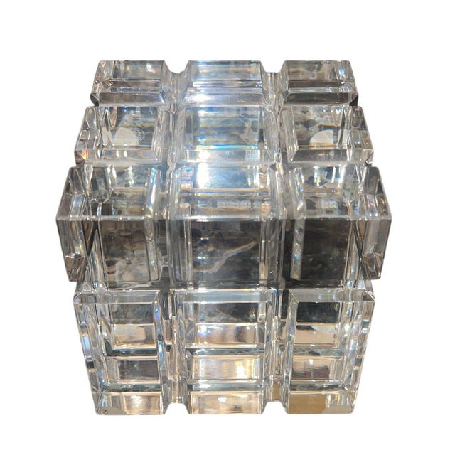 A refined assortment of Baccarat crystal decorative objects, comprising the celebrated Sirius crystal sphere on its...