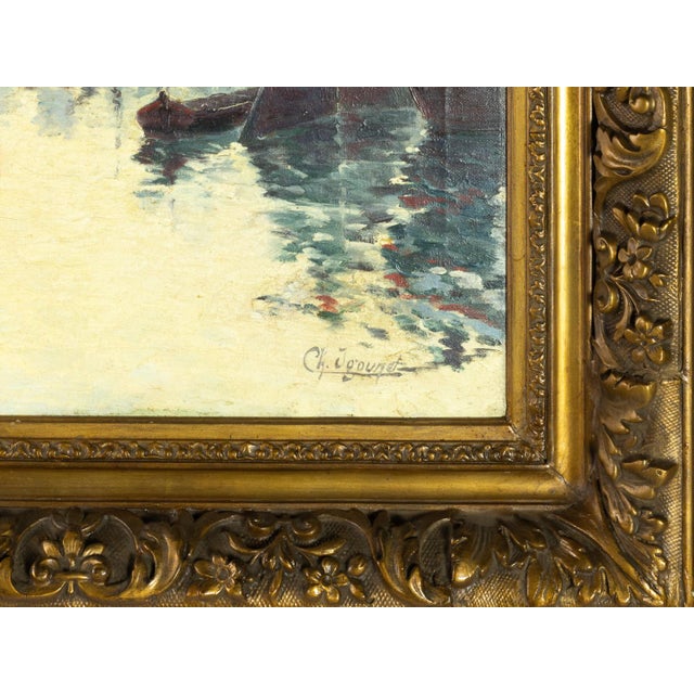 This French Impressionist painting by Charles André Igounet de Villers (1881–1944) captures a nautical scene with boats...