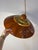 This pendant lamp from Belgium is a gem of mid-century design, perfectly capturing the warm, vibrant aesthetic of the era....
