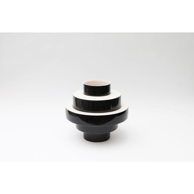This ceramic Mont&eacute;e vase is in a glossy black and white. Stamped by Maker,Stamped by Maker