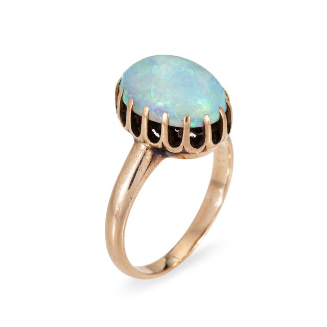 Sweet antique Victorian era ring (circa 1880s to 1900s), crafted in 14 karat yellow gold. Cabochon cut opal measures 12mm...
