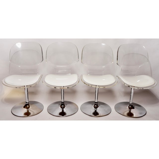 Brilliantly clear Lucite and a Chrome based swivel dining chairs by Charles Hollis Jones for Hill Manufacturing.These...