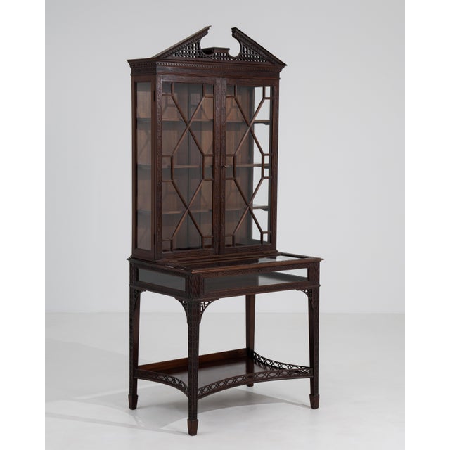 A distinguished example of the Chippendale tradition, this fine 19th-century English vitrine unites masterful...
