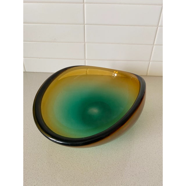 Lovely hand-blown bowl in the style of Barbini in an usual ombre color shifting from gold to turquoise. Elegance on the...
