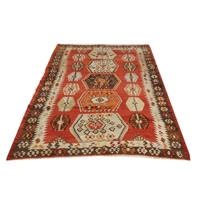 Decorative handwoven vintage kilim rug from Sivas region of Turkey. Approximately 50-60 years old. In very good condition.