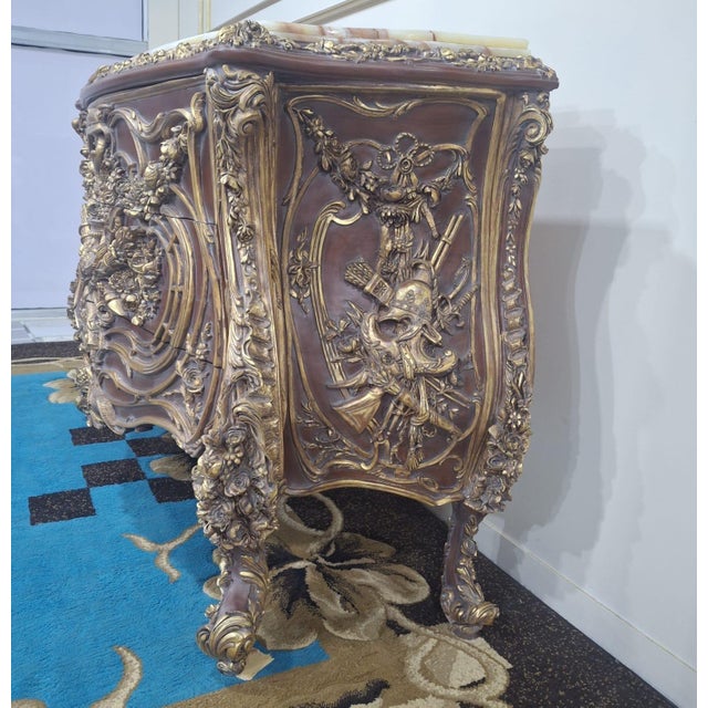 Description Reach out for arrangements A breathtaking example of French Rococo artistry, this Louis XV Bombe Commode is...