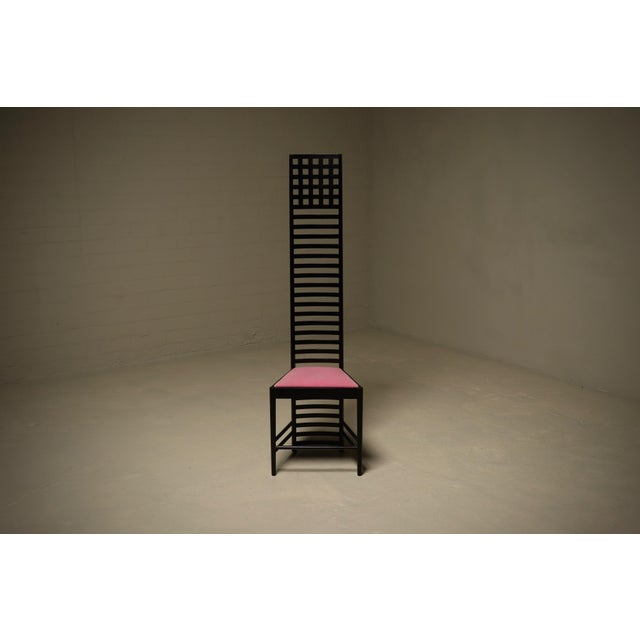 An iconic first edition “Hill House 1” chair, designed by Charles Rennie Mackintosh and produced by Cassina in the 1970s....