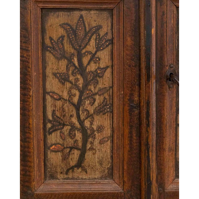 This original 19th-century painted wall cabinet is a charming example of rural European craftsmanship, retaining its...