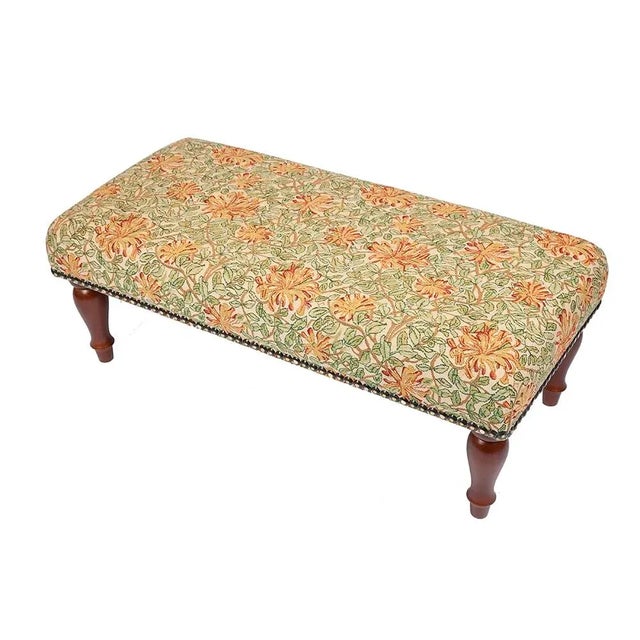 Hand upholstered in the UK with classical studding and hand polished solid beech legs, ideal for an extra seat or a centre...