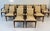 Elegant set of twelve Italian dining armchairs produced in the 1950s, beautifully combining the timeless balance of...