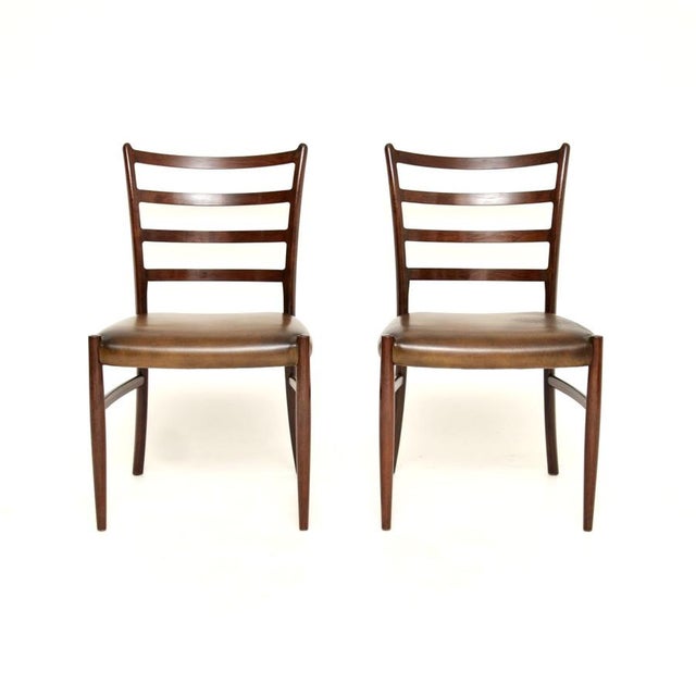 A rare and extremely stylish pair of Danish chairs by Johannes Andersen. They were made in Denmark, they date from the...