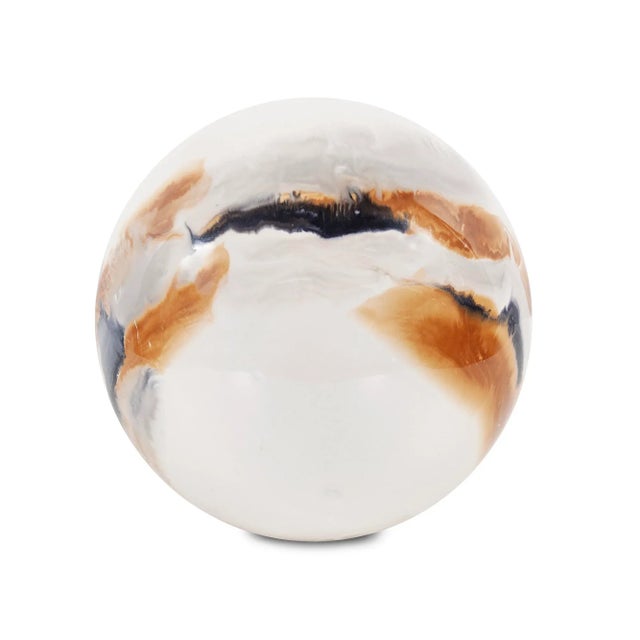 Inspired by the volcanic lava flows that occur when cool and hot debris is combined together. The iron spheres are...