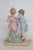 This beautiful Figurine is made out of porcelain. This lovely decorative piece features two figures, a young boy and young...