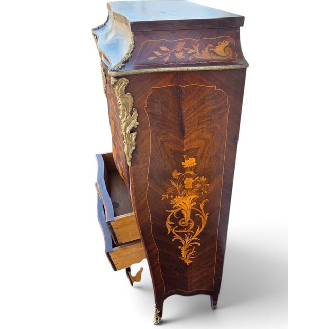 The French Napoleon the 3rd Rosewood Marketry Secretary Masterpiece is an antique desk made of wood with a rosewood...