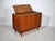 Bar sideboard by Musterring in teak with an integrated drop-down compartment, two sliding doors, and tapered solid wood...