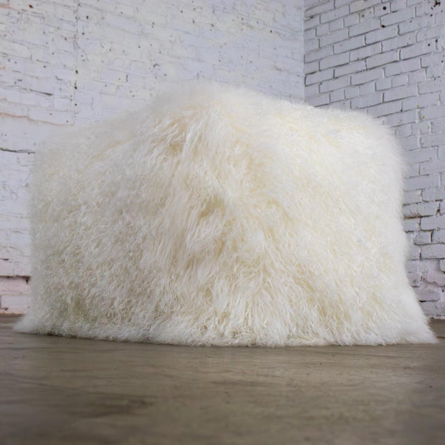 Magnificent vintage Modern square ottoman or pouf wearing white Mongolian sheepskin. Beautiful condition, keeping in mind...