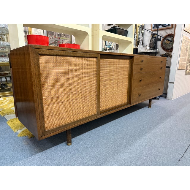 You are viewing a beautiful Mahogany and Sliding Caned Door Credenza by Harvey Probber c1950s. This classic mid century...