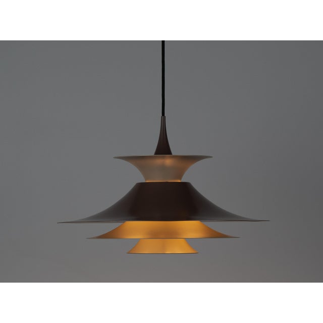 The Radius pendant lamp was designed in 1977 by Danish designer Erik Balslev for the renowned Danish lighting manufacturer...