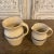 Offered here is a matching pair of Marshall Pottery stoneware pitchers made by the Marshall Pottery Company in Marshall,...