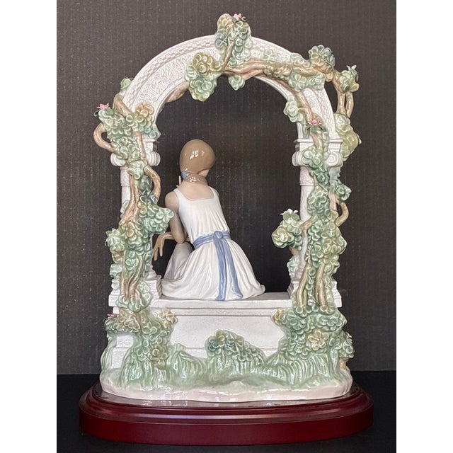 Figurative Lladró Tranquility (Model #06677) Porcelain Figurine, Featuring a Seated Woman Under a Floral Arbor For Sale - Image 3 of 6