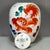 A charming Chinese Wucai (five-color) porcelain covered jar. The white ground is hand-painted with vibrant, stylized...