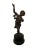 A bronze, whimsically musical-themed cherub statue with marble base. The dancing cherub base has a detailed ground carving...